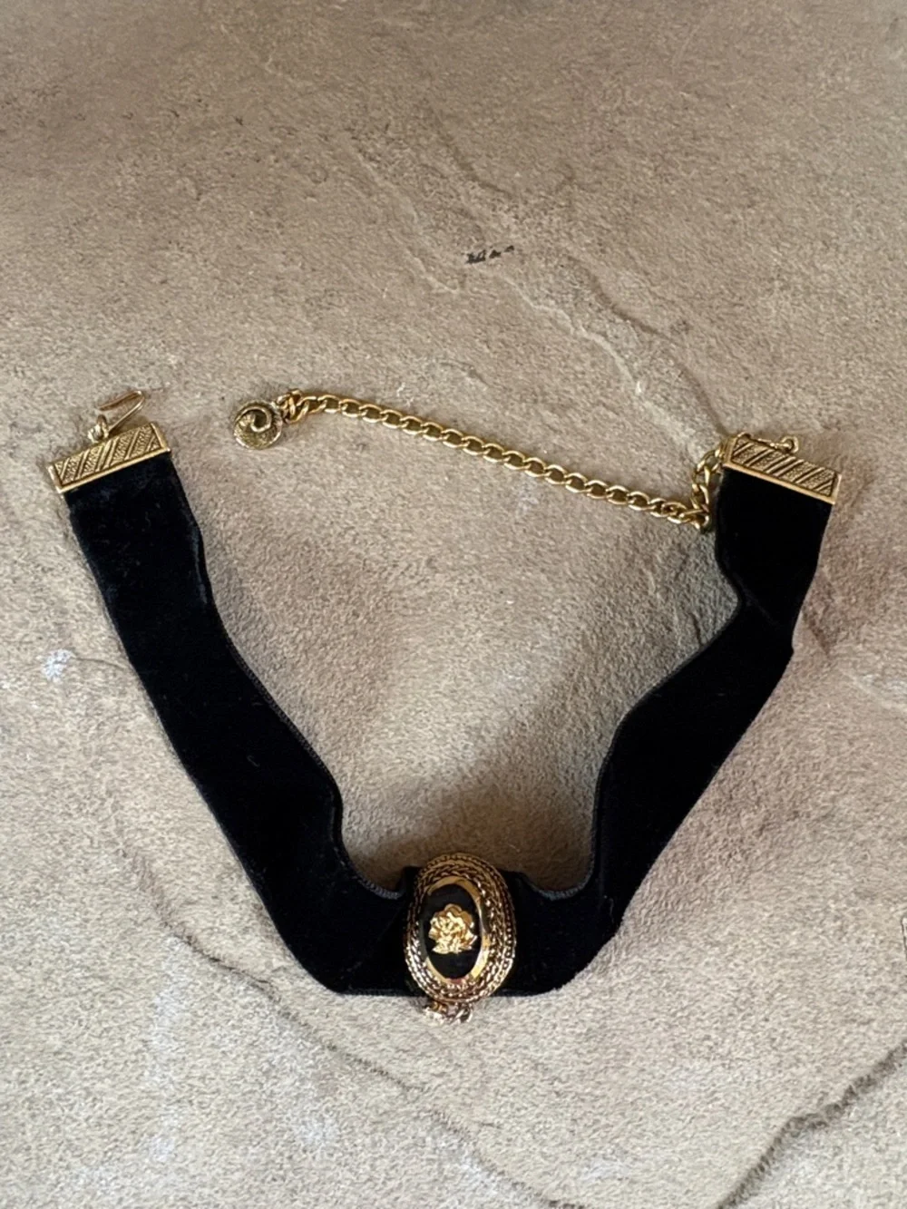 Celebrity black velvet choker with gold tone rose accent